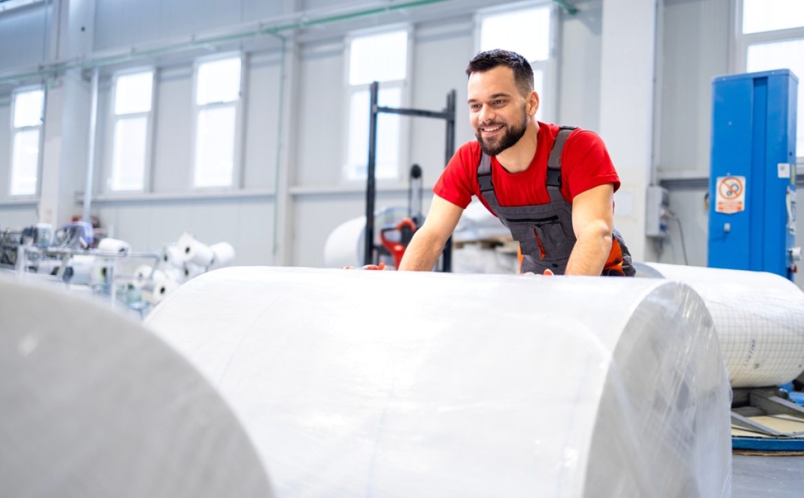 Working,In,Cellulose,Factory,Pushing,Rolls,Of,New,Paper.