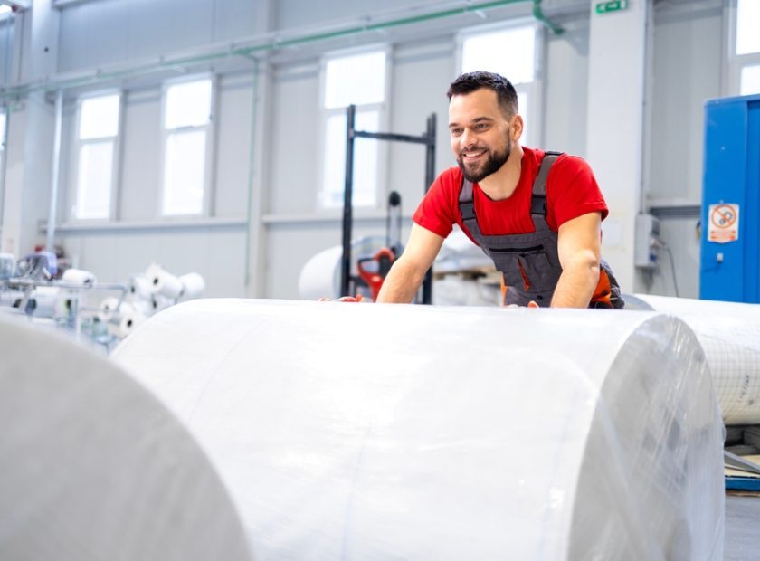 Working,In,Cellulose,Factory,Pushing,Rolls,Of,New,Paper.