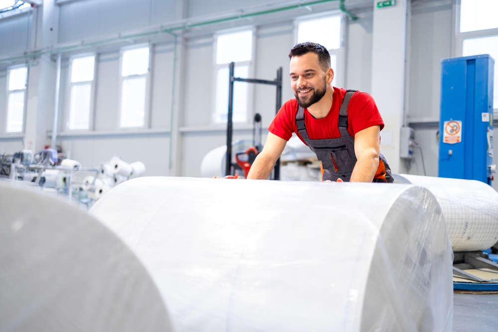Working,In,Cellulose,Factory,Pushing,Rolls,Of,New,Paper.